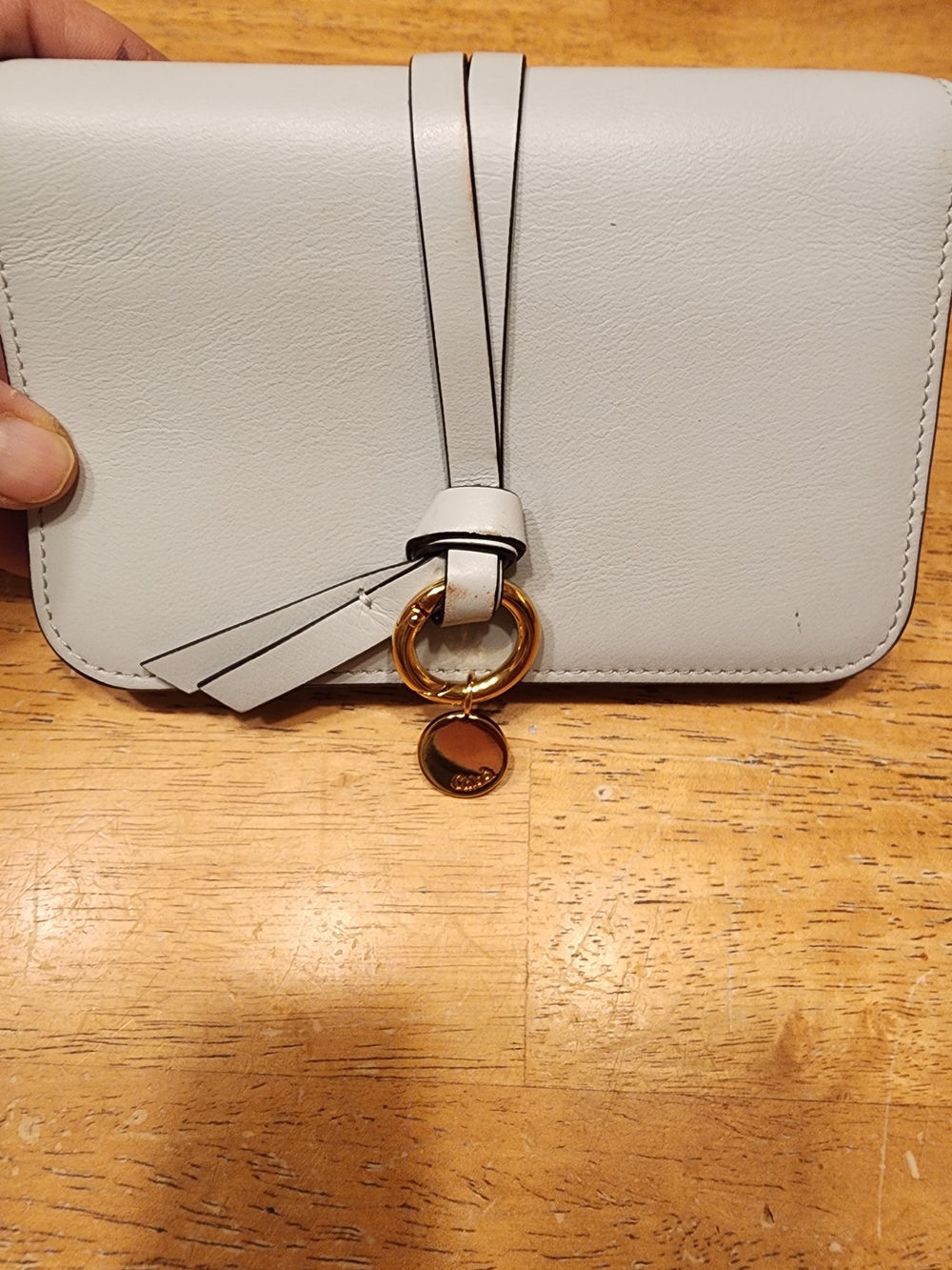 light grey Chloé Alphabet Long Wallet features a distinctive knotted leather